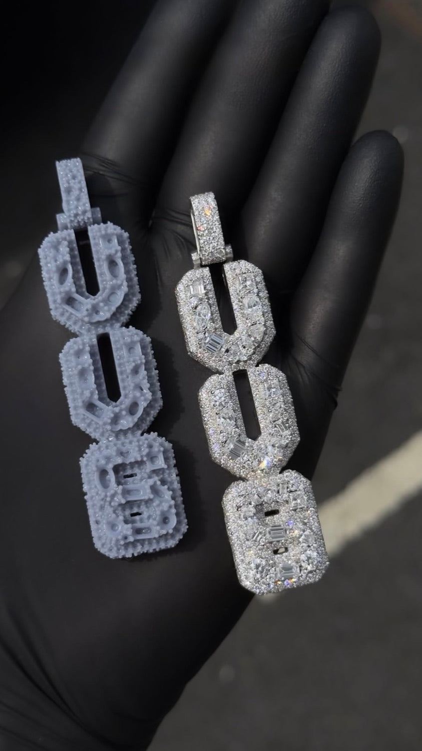 The same pendant twice. The grey resin mould on the left, the finished fully set piece on the right.
